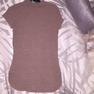 A long brown knitted, light - sweater, shirt.